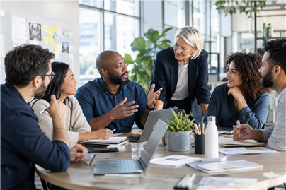 A diverse team participating in an organization workshop